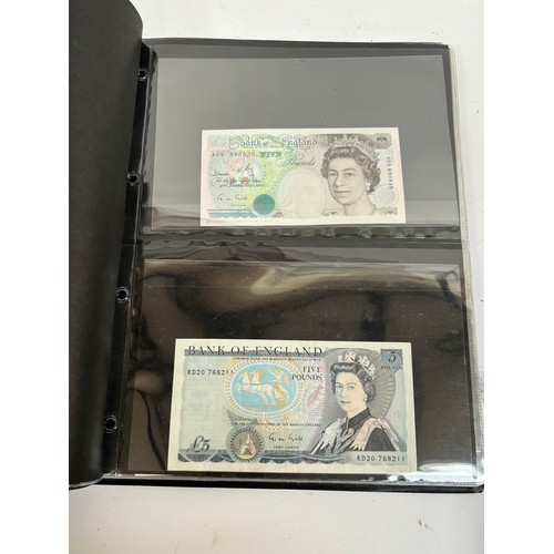 331 - An album of United Kingdom banknotes, including 2 white £5 notes, £1 notes from circa 1930, 1940, 19... 