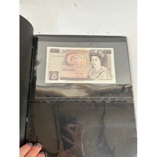 331 - An album of United Kingdom banknotes, including 2 white £5 notes, £1 notes from circa 1930, 1940, 19... 