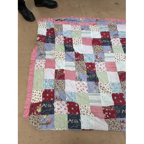 376 - A World War I patchwork quilt, floral decoration and frilled outer edge, 230cm x 240cm, a second mid... 