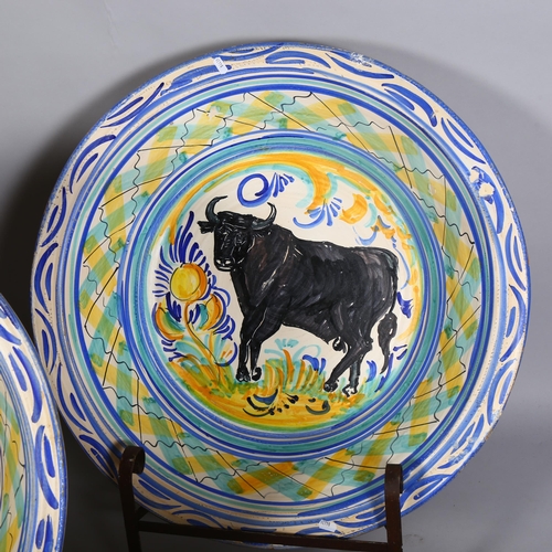 413 - A massive set of 4 Spanish faience pottery bowls, with painted animals, diameter 73cm, on wrought-ir... 