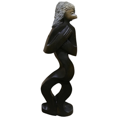 421 - A large African carved spring stone sculpture, The Mermaid by Witness Bonjisi, height 108cm