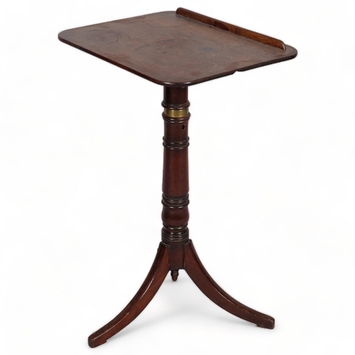 104 - A George III mahogany reading table, with rise and fall tilt top, brass adjusting mechanism and trip... 