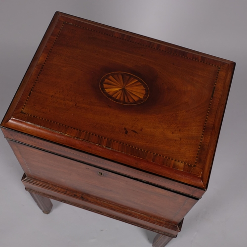 106 - George III mahogany cellarette, the inlaid top having a concave edge, brass carrying handles and div... 