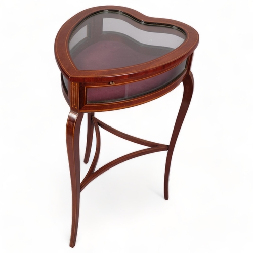 108 - An Edwardian mahogany heart-shaped vitrine table, with inlaid stringing, curved side panels, on shap... 