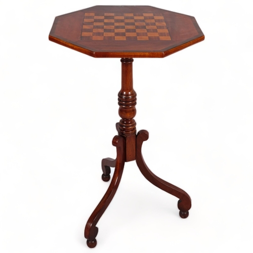 110 - A 19th century mahogany octagonal games top table, on tripod base, width 44.5cm, height 73cm.