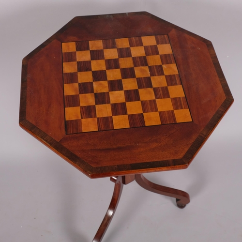 110 - A 19th century mahogany octagonal games top table, on tripod base, width 44.5cm, height 73cm.