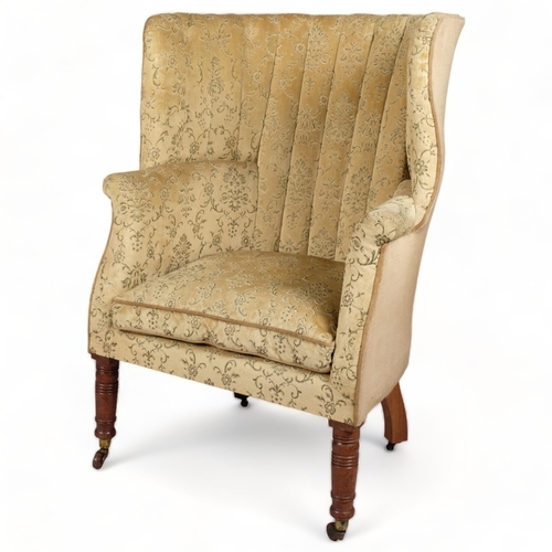 116 - A 19th century upholstered barrel-back wing armchair on turned legs, overall width 76cm, height 112c... 