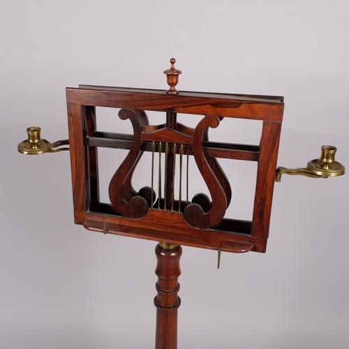 117 - A 19th century rosewood duet music stand, with brass candle brackets, adjustable column and platform... 