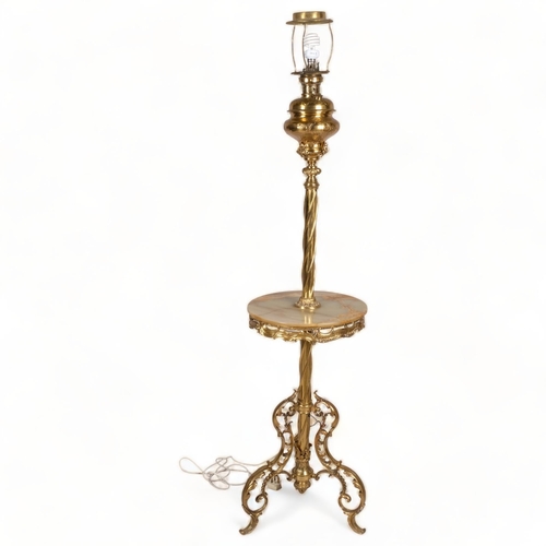 124 - A 19th century gilt-brass standard lamp with onyx table section, on acanthus tripod base, converted ... 