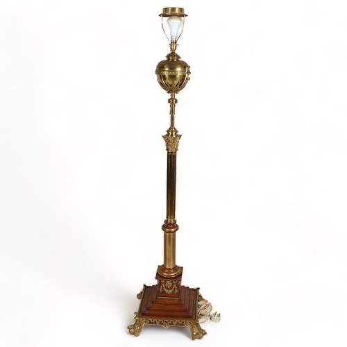 125 - 19th century brass and oak Corinthian column standard lamp, converted to electric, on stepped oak br... 