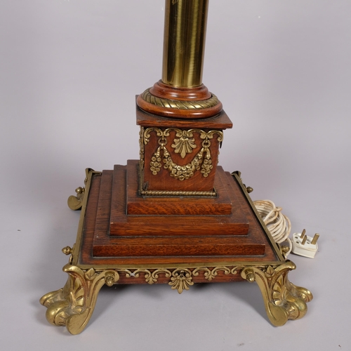 125 - 19th century brass and oak Corinthian column standard lamp, converted to electric, on stepped oak br... 