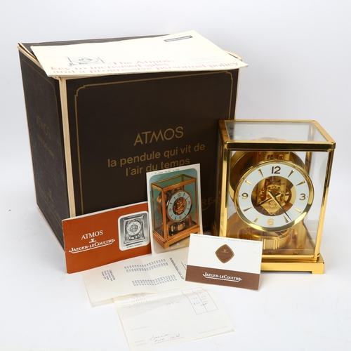 127 - JAGER LECOULTRE - Atmos clock, circa 1975, height 22cm, boxed with papers and service receipt dated ... 