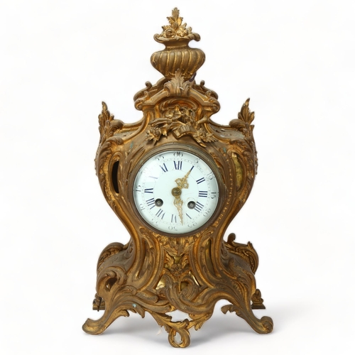 135 - 19th century French Rococo style gilded spelter-cased mantel clock, with enamel dial and 8-day strik... 