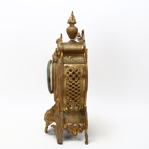 135 - 19th century French Rococo style gilded spelter-cased mantel clock, with enamel dial and 8-day strik... 