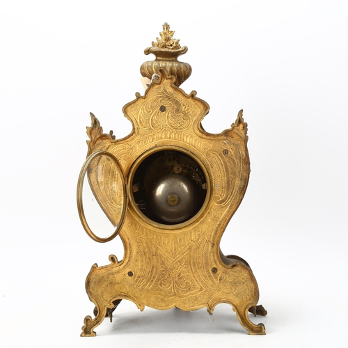 135 - 19th century French Rococo style gilded spelter-cased mantel clock, with enamel dial and 8-day strik... 