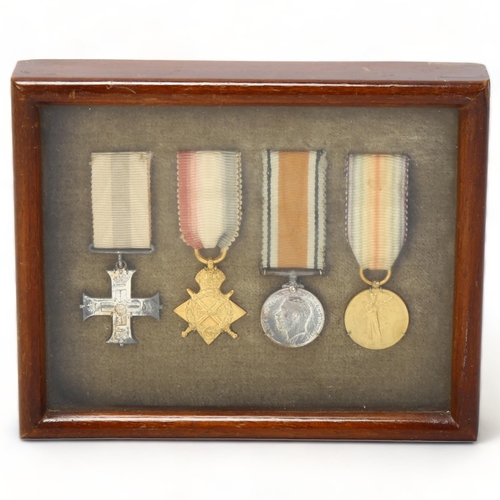 155 - A Military Cross group of 4 Great War miniature medals, mounted in Spink & Son glazed mahogany frame... 