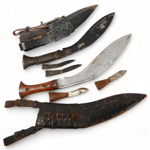 174 - 2 Second War Period kukri knives in leather sheaths, with original miniature knives