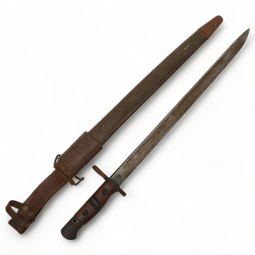 175 - US Army military bayonet in original leather scabbard, overall length 57cm, blade length 43cm, blade... 