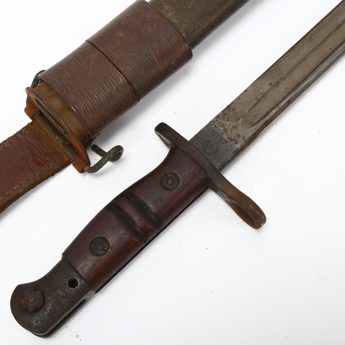 175 - US Army military bayonet in original leather scabbard, overall length 57cm, blade length 43cm, blade... 