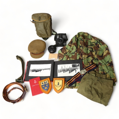 184 - Military uniform, photograph album, camouflage belts and cap of RH Rigg, circa 1960s