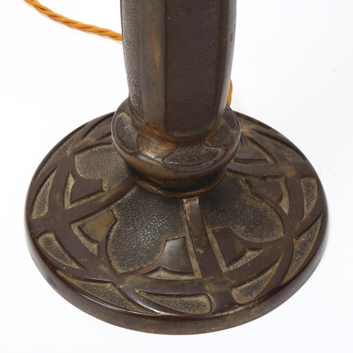 189 - An early 20th century relief cast bronze table lamp in the manner of Tiffany, no factory marks, over... 