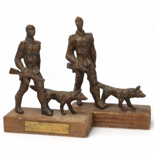 190 - Mid-20th century European School, 2 bronze sculptures of soldiers with dogs, mounted on woodblock ba... 