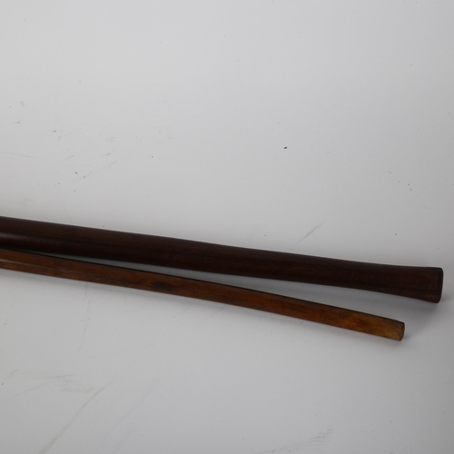 192 - An African hardwood spiral twist ceremonial staff, and a similar hardwood twist design stick (2)