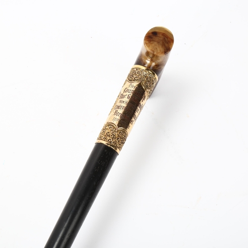 193 - An Edwardian ebony walking cane, with horn handle and gilt-metal mounts, dated 1905