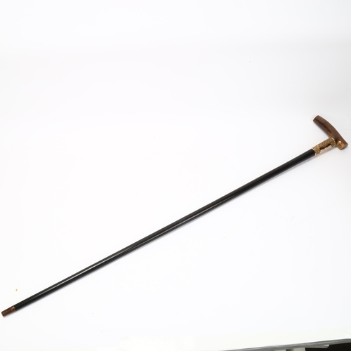 193 - An Edwardian ebony walking cane, with horn handle and gilt-metal mounts, dated 1905