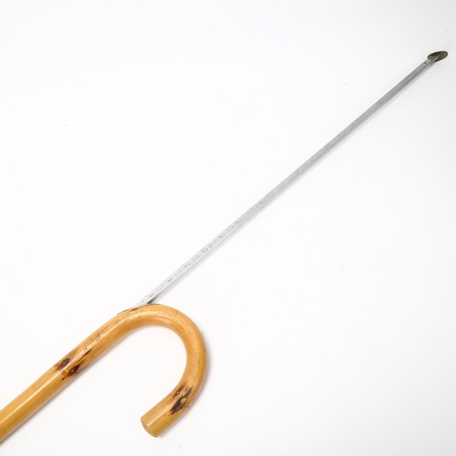 194 - A horse measuring walking stick, with integral spirit level