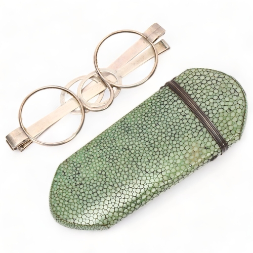 197 - A pair of 18th century white metal spectacles, impressed maker's marks JM, in original shagreen case... 