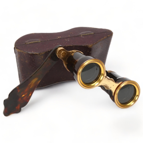 201 - Pair of Victorian tortoiseshell and gilt-metal opera glasses, with folding handle, in Morocco leathe... 