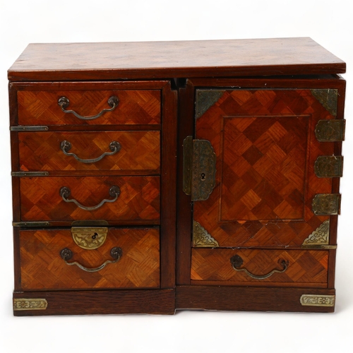 214 - A small Japanese Meiji Period travelling cabinet, circa 1900, allover parquetry inlaid decoration wi... 