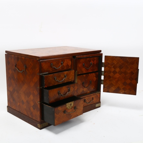 214 - A small Japanese Meiji Period travelling cabinet, circa 1900, allover parquetry inlaid decoration wi... 