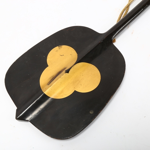 216 - A Japanese Gunbai Uchiwa (military leader's war fan), gilded black lacquer with floral engraved bras... 