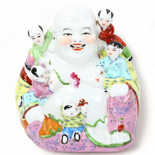 222 - A Chinese porcelain seated Buddha with children, height 22cm