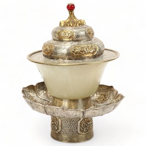 224 - A Chinese jade ceremonial cup, in unmarked chased parcel-gilt white metal lotus flower design stand,... 