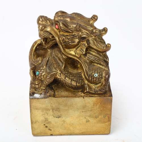 225 - A Chinese solid cast gilt-bronze dragon design desk seal, set with turquoise and coral, height 12.5c... 