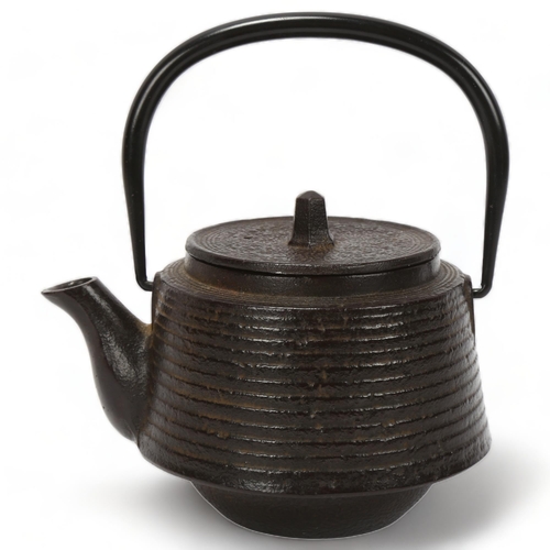 227 - A Japanese cast-iron tea kettle, signed with seal, height 15cm