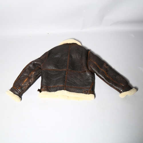 250 - A good quality pilot aviator style jacket, brown leather and fleece-lined, size small/medium