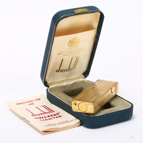 258 - DUNHILL - gold plated pocket lighter, length 62mm, boxed with papers