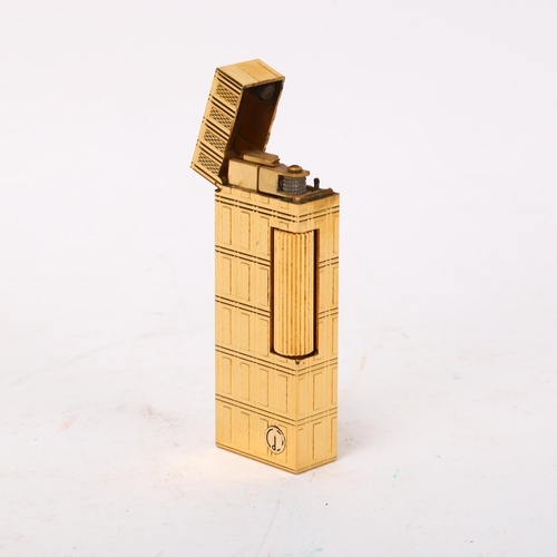 260 - DUNHILL - gold plated pocket lighter, length 64mm, boxed with papers