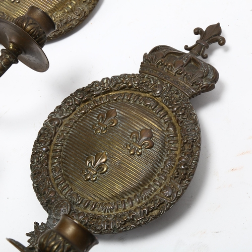 287 - A pair of 19th century bronze twin-branch candle wall sconces, with King Henry IV of France armorial... 