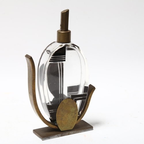 321 - French Art Deco black and clear glass perfume bottle, in bronze stand, height 17cm