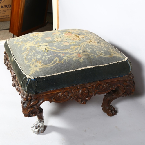 351 - A large Victorian carved oak-framed stool, on elaborate base with lion paw feet, approx 70cm square