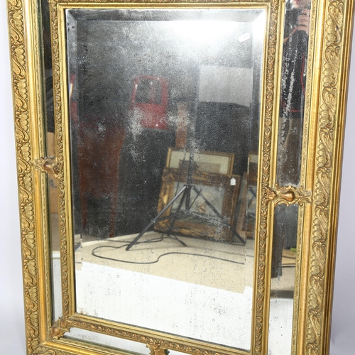 408 - A 19th century Venetian gilt framed mirror, bevelled glass central panel with angled mirror panels s... 