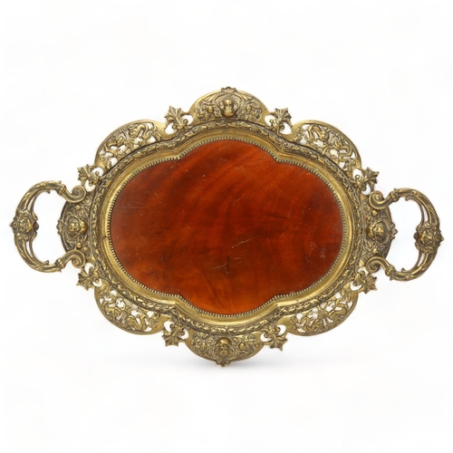 74 - 19th century cast-brass framed 2-handled tray, with inset mahogany panel in pierced and shaped surro... 