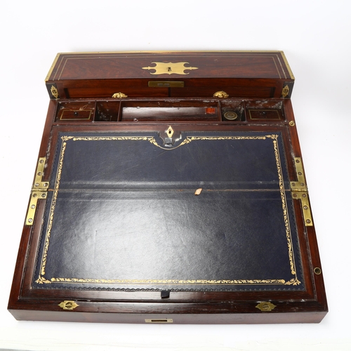 92 - An unusual 19th century brass-bound rosewood campaign travelling writing box, with rising drawer-fit... 