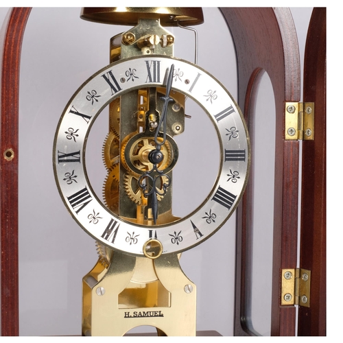 144 - A modern Hermle mahogany-cased dome-top mantel clock with brass columns, movement striking on a bell... 