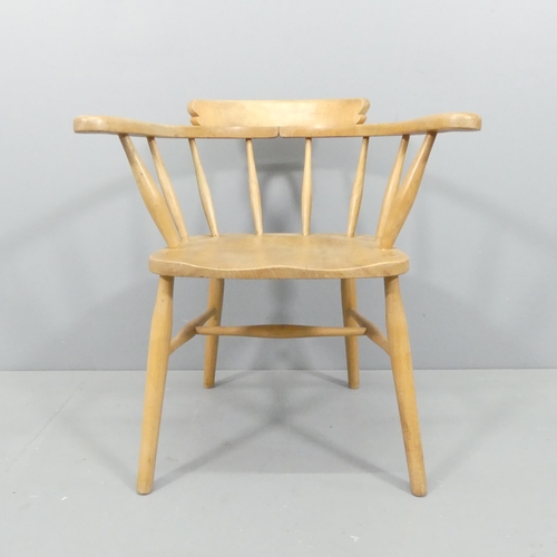 2015 - A mid-century light elm bow-arm Captain's chair.